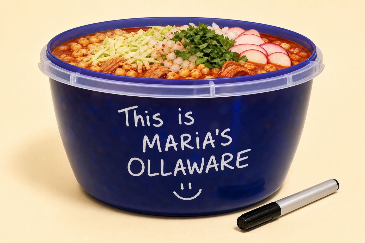 A blue OllaWare container filled with pozole, labeled with Maria's name, with a dry erase marker nearby