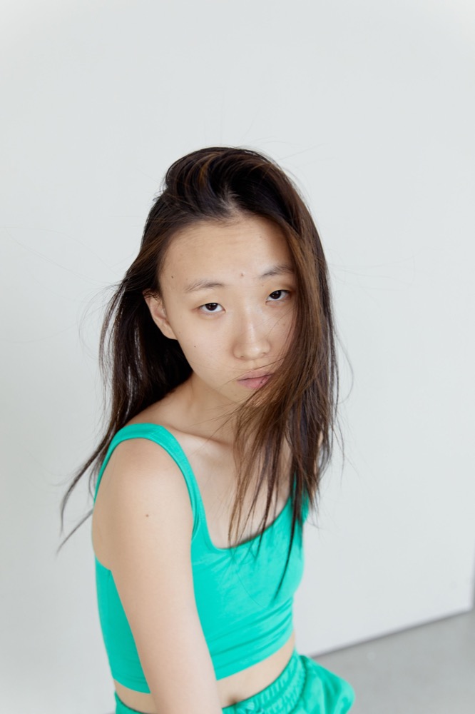 Chloe in a green outfit